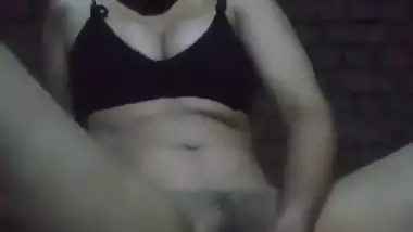 Young horny girl masturbates with a big wooden handle