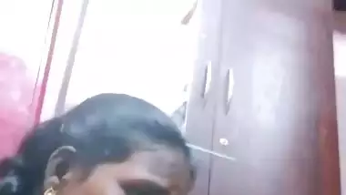 Mature tattooed Tamil wife giving handjob to husband